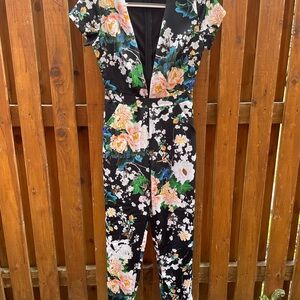 Black Floral Jumpsuit with Cut out front, perfect condition, size S/4